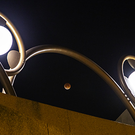 Lunar Eclipse of the moon over Tempe Arizona Gammage Auditorium.